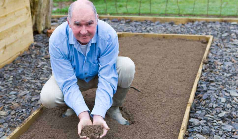 Man is preparing the soil for planting